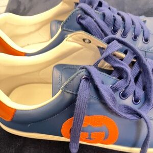 Preowned Gucci Blue Sneakers with Orange Logo Accent size 9/42. Belong to my son